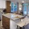 a kitchen with a marble island