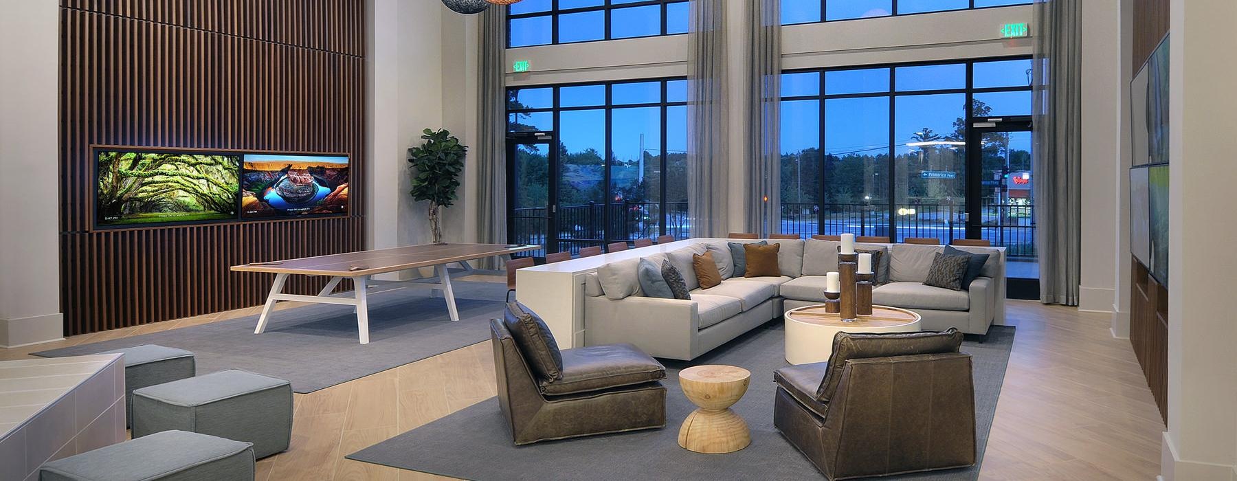 a room with a couch and a table and chairs