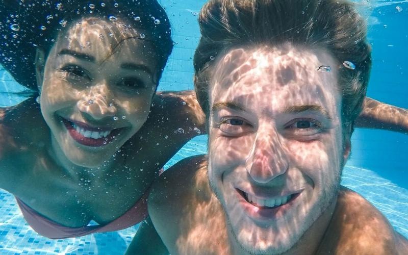 a man and woman in a pool
