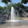 a fountain with water in a park