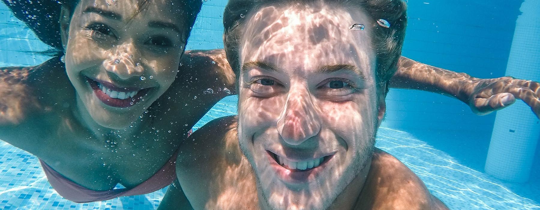 a man and woman in a pool